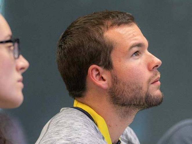 Two students looking up and focusing